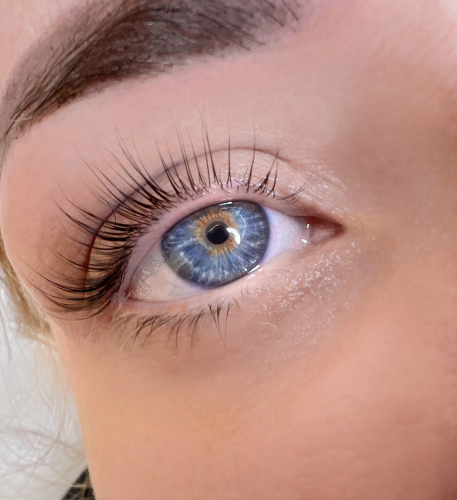 Lash and brow lamination close-up with lifted lashes and clean brow definition