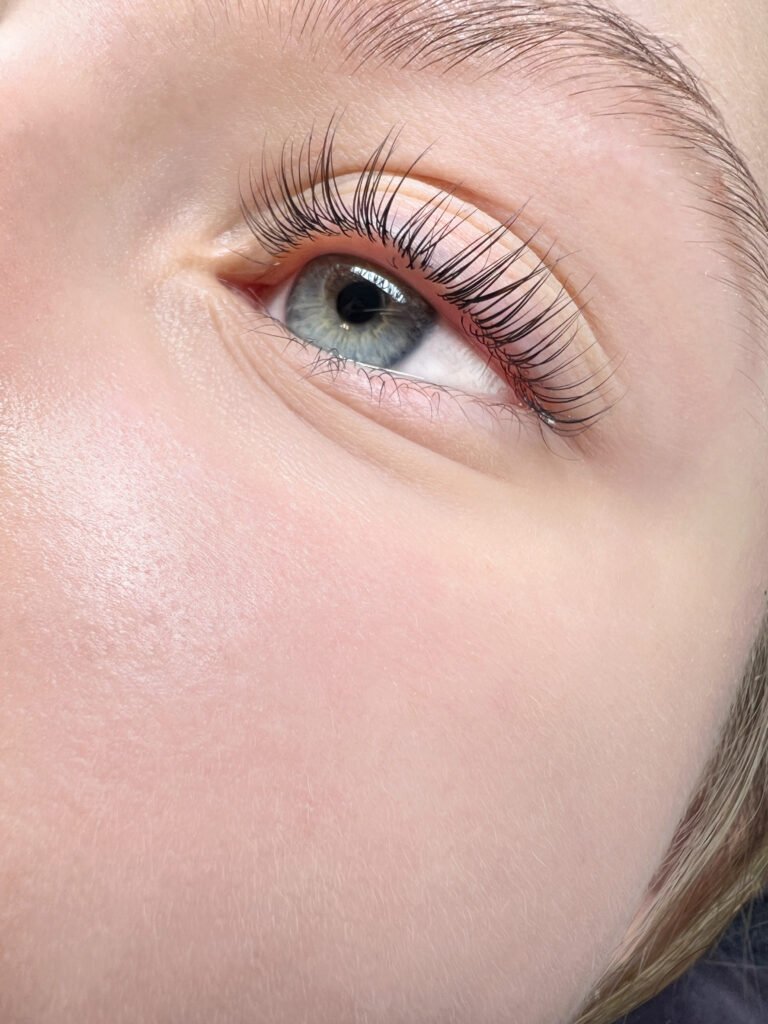 Natural lash lamination close-up with lifted lashes around the eye