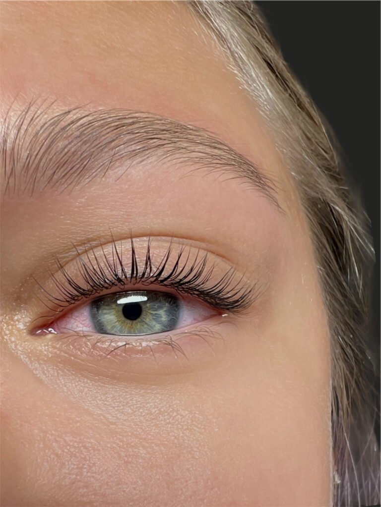 Lash lamination close-up with clean lifted lashes and soft definition