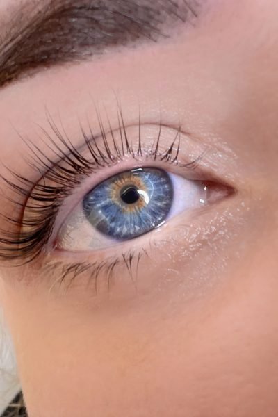 Lash and brow lamination close-up with lifted lashes and clean brow definition