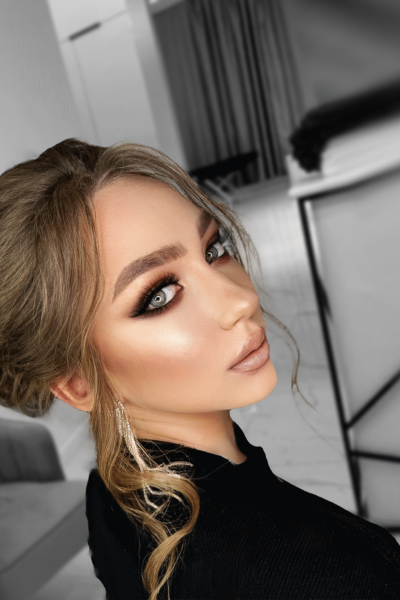 Evening glam event makeup with smokey eyes and radiant skin in Chicago