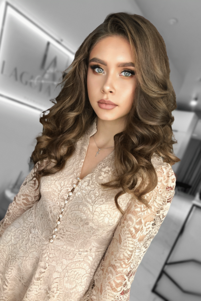 Soft Hollywood waves hairstyle with smooth curls and elegant shine in Chicago