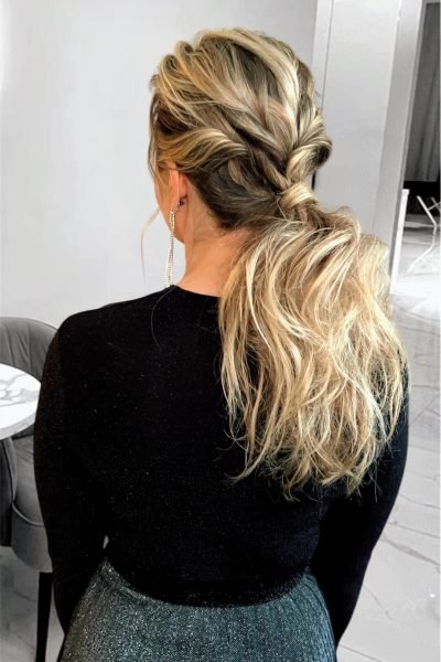 Textured low ponytail with braids and soft volume for weddings and events in Chicago