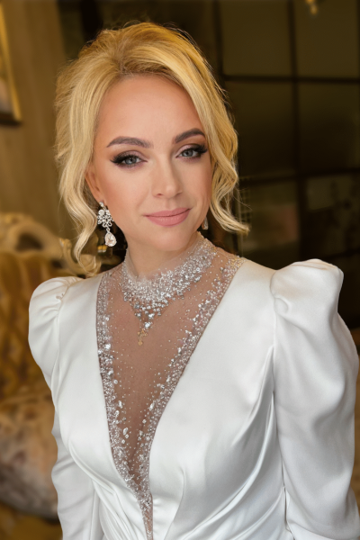 Glamorous bridal makeup and hair with soft smoky eyes and elegant hairstyle by ABC Face in Chicago