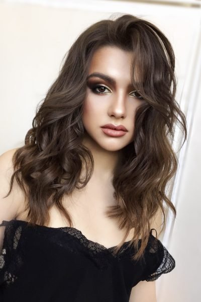 Bronze glow event makeup with warm tones and radiant skin in Chicago