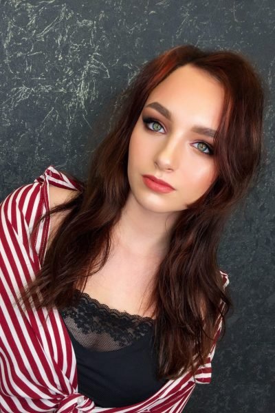 Smokey rose event makeup with glowing skin and soft eye definition in Chicago