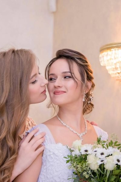 Soft romantic bridal makeup and elegant updo hairstyle by ABC Face in Chicago