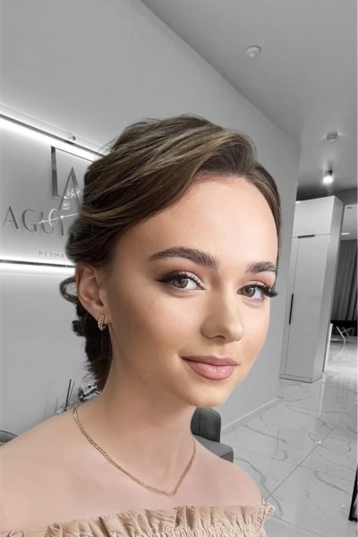 Soft glam event makeup with natural tones and elegant hairstyle in Chicago